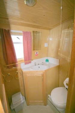 The bathroom with flush toilet The bathroom with flush toilet